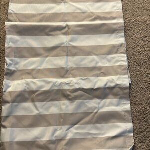 Striped Gray and White floor length blackout curtains.